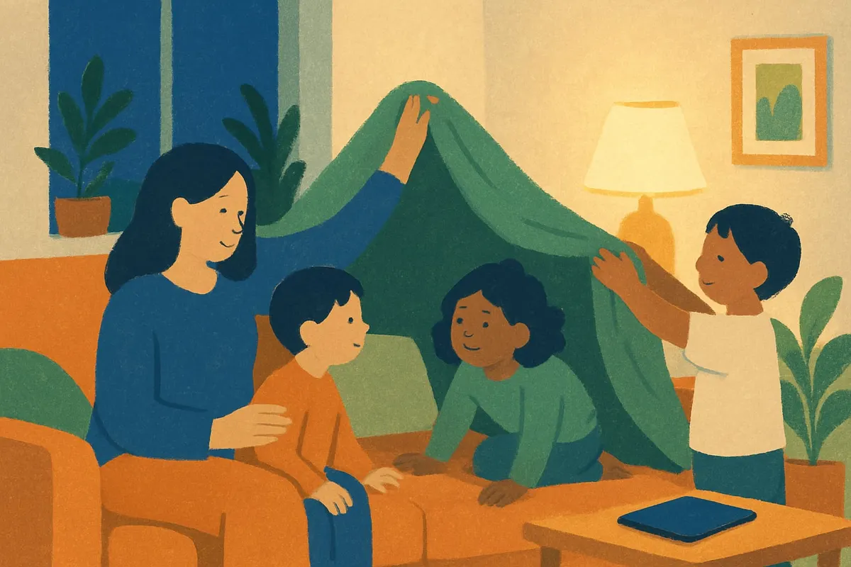 A tablet lies face down while a parent and two children build a blanket fort on the sofa.